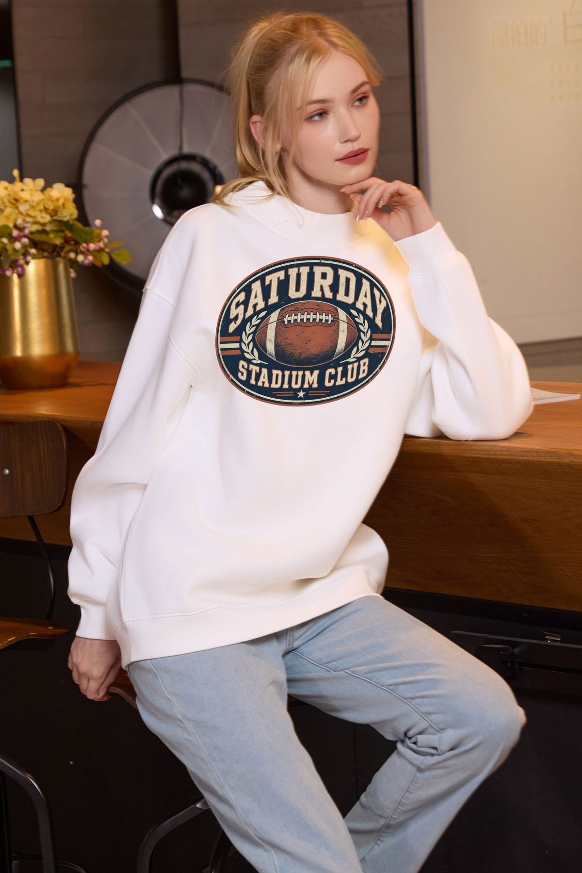 Saturday Stadium Club Mockneck Sweatshirt in white, front graphic on model, view 1