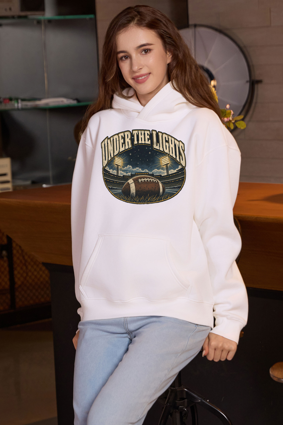 Under the Lights Hoodie in white, front graphic on model, view 2