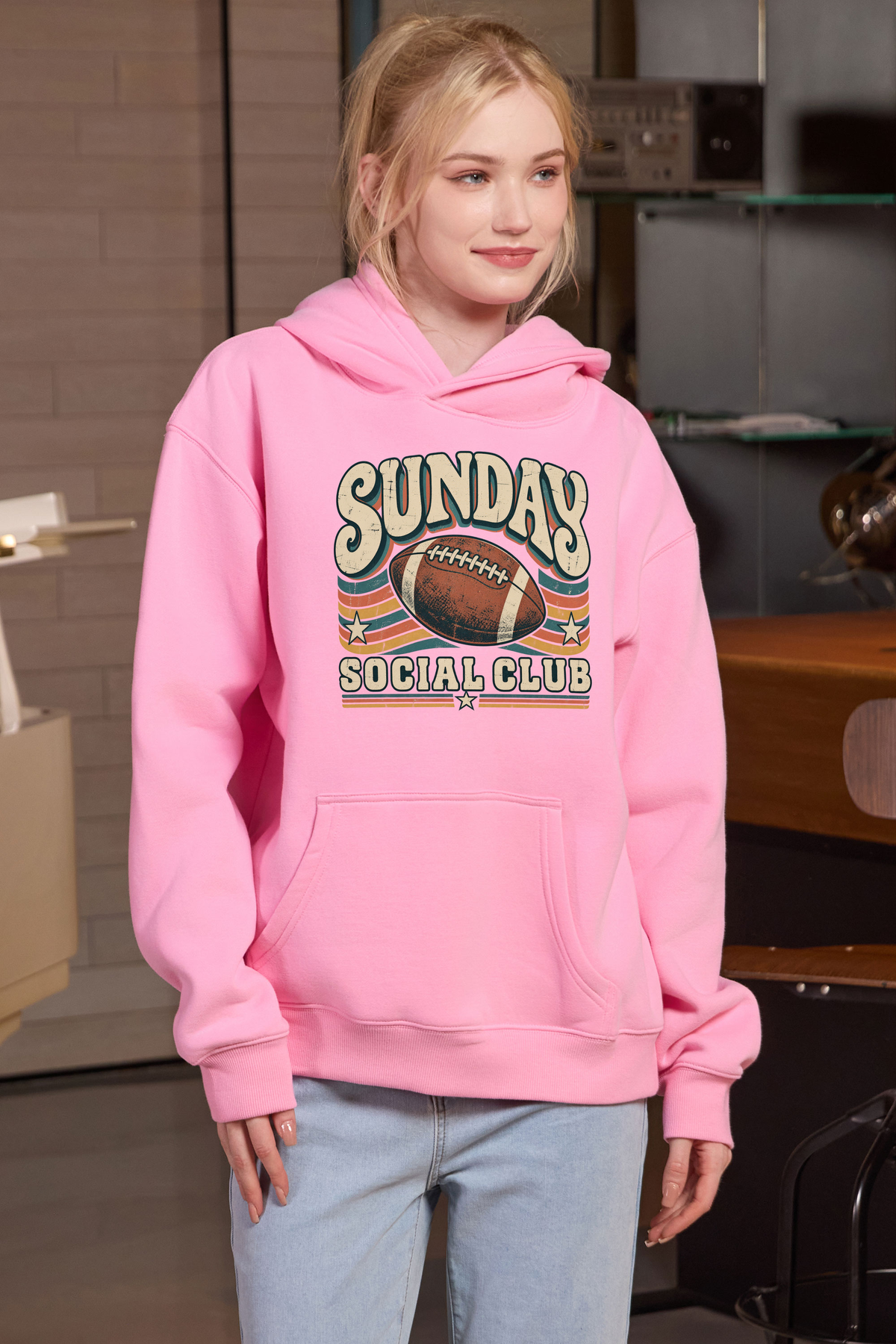 Sunday Social Club Hoodie in light pink, front graphic on model, view 3