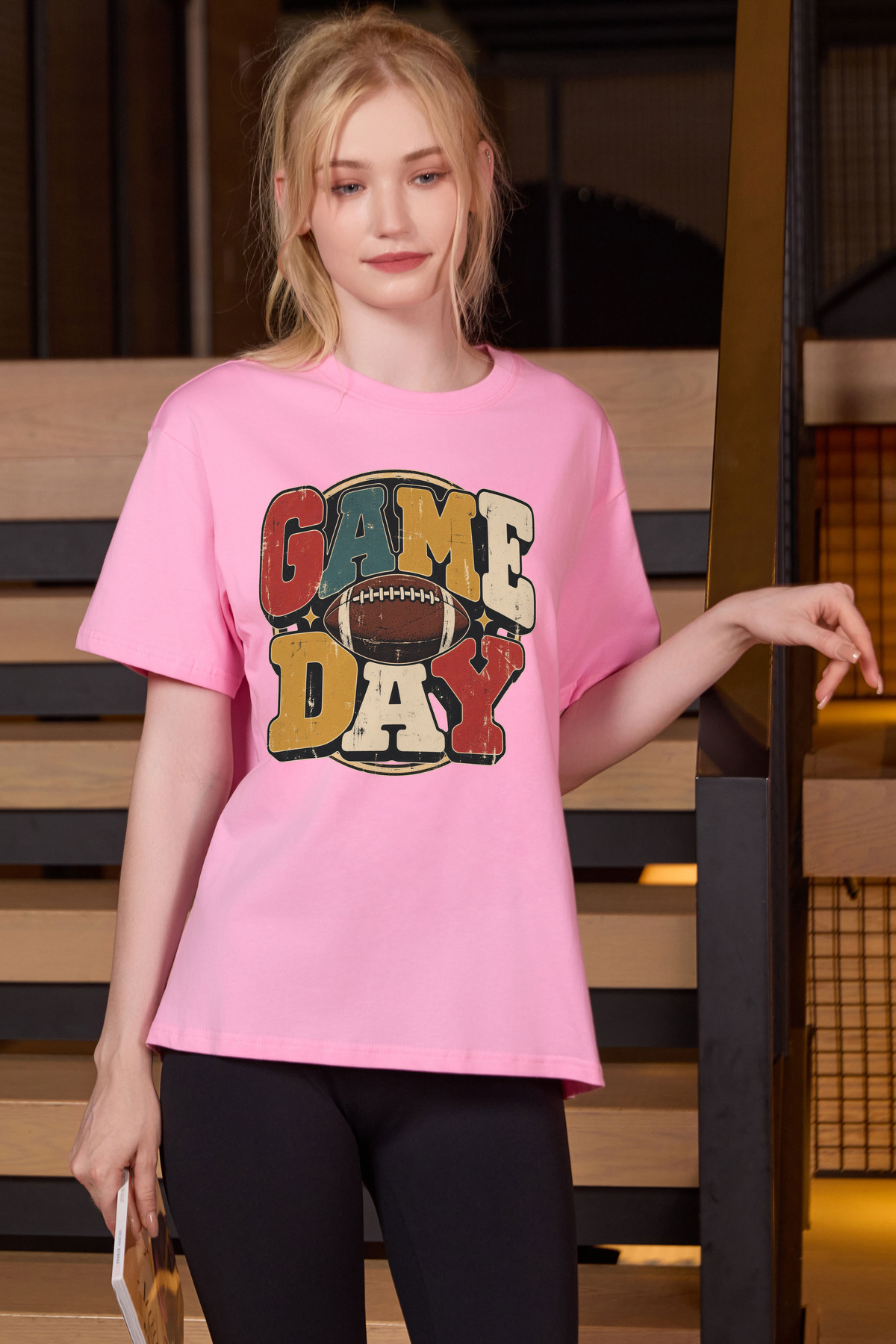 Retro Game Day Relaxed Tee in light pink with multicolour GAME DAY lettering and a football graphic.
