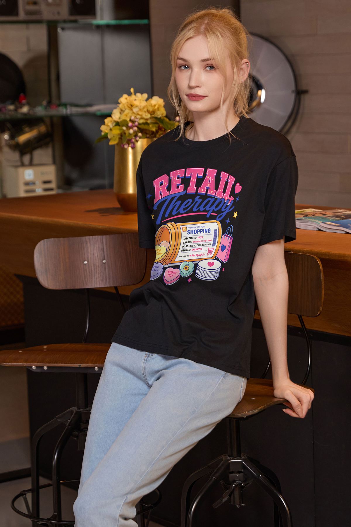 M001-F021 BLACK F2 — Retail Therapy graphic on M001 black garment