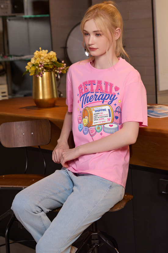 M001-F021 LIGHT-PINK F3 — Retail Therapy graphic on M001 light pink garment