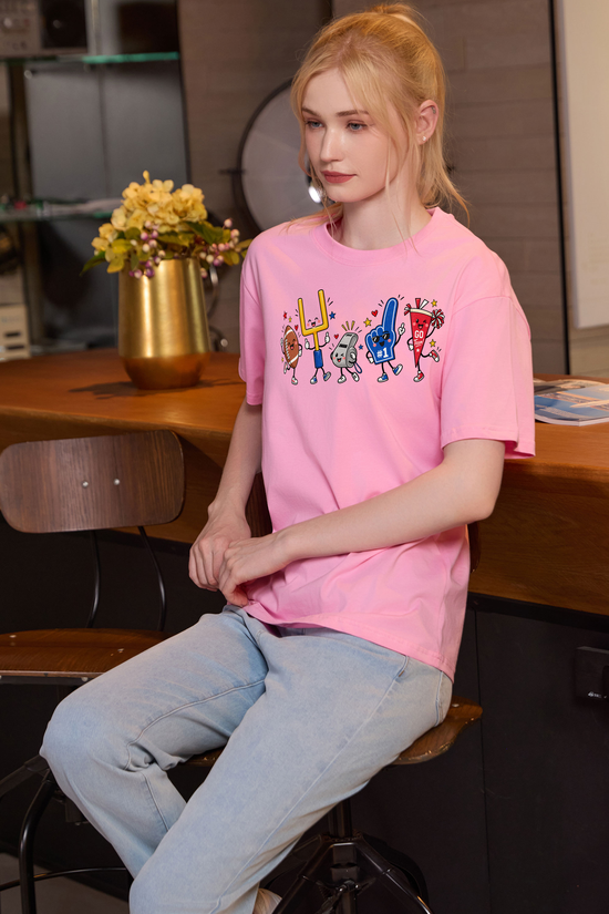 M001-G019 LIGHT-PINK F3 — Game Day Characters 2 graphic on M001 light pink garment
