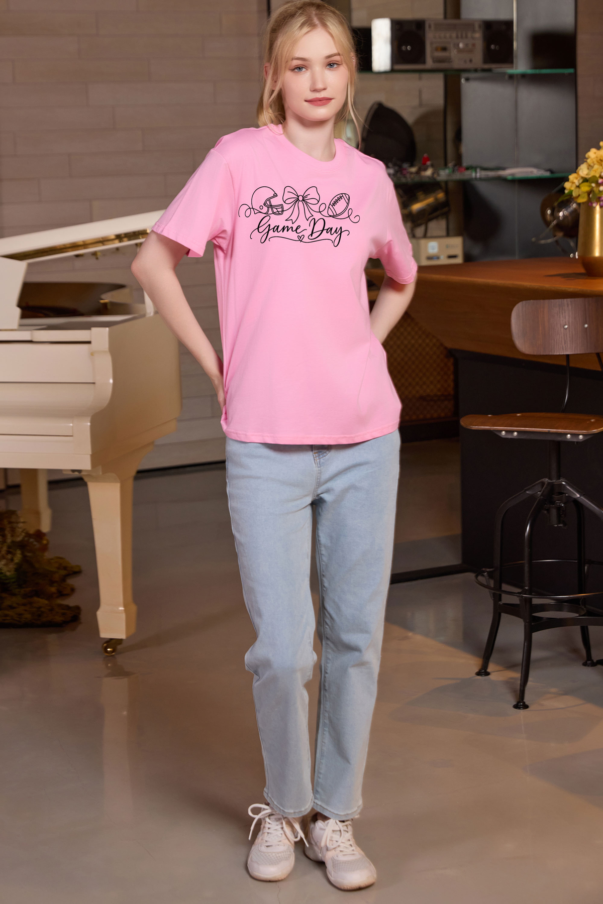 M001-G020 LIGHT-PINK A1 — Game Day String graphic on M001 light pink garment