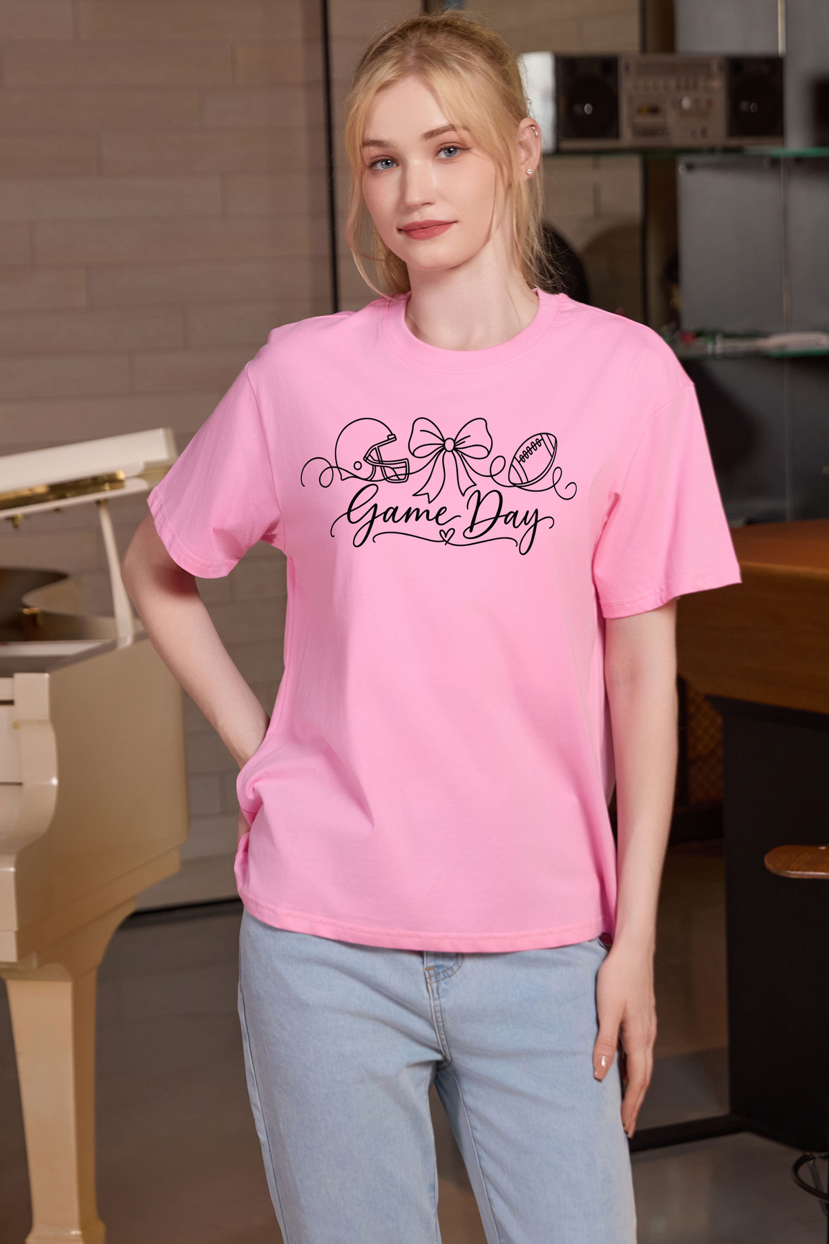 M001-G020 LIGHT-PINK F1 — Game Day String graphic on M001 light pink garment