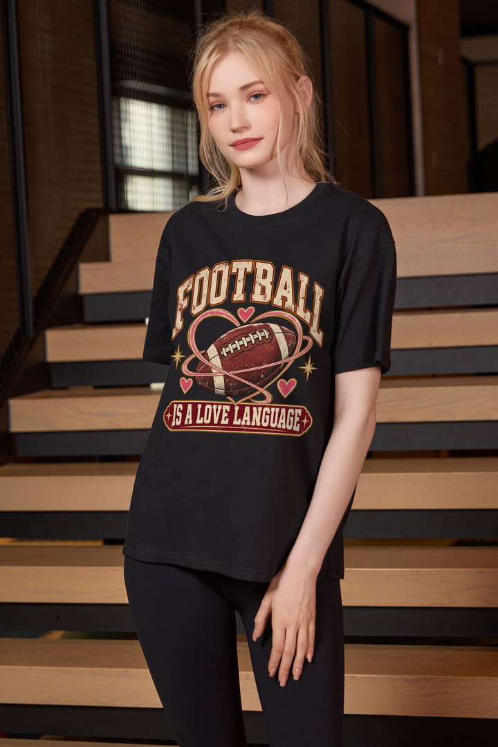 Football Is a Love Language Relaxed Tee in black, front graphic on model, view 1
