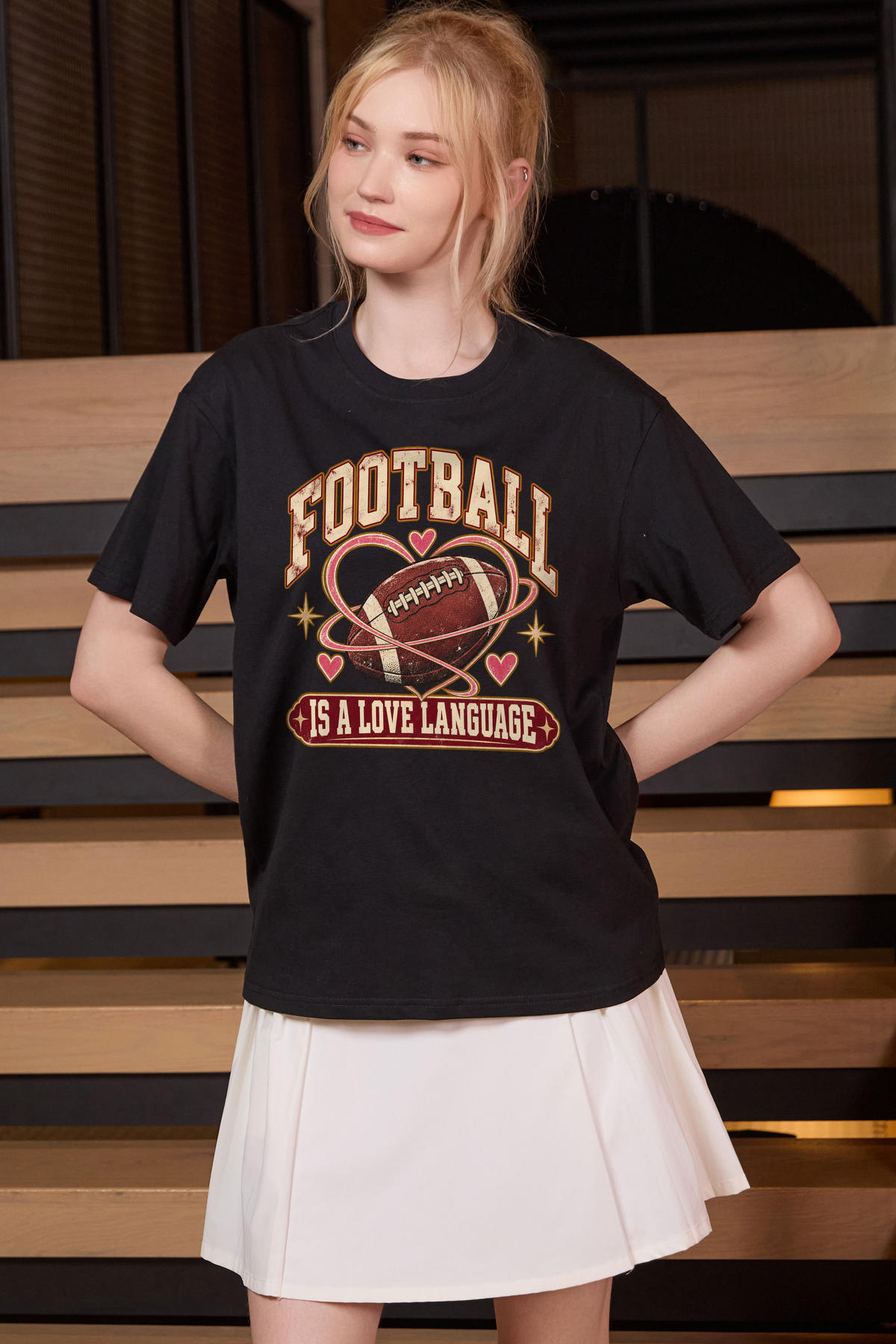 Football Is a Love Language Relaxed Tee in black, front graphic on model, view 2
