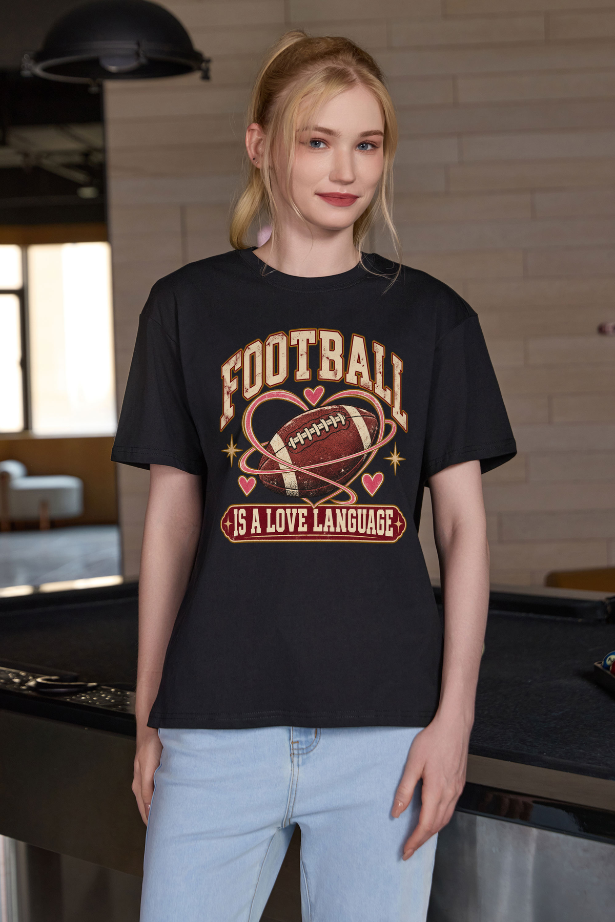 Football Is a Love Language Relaxed Tee in black, front graphic on model, view 3