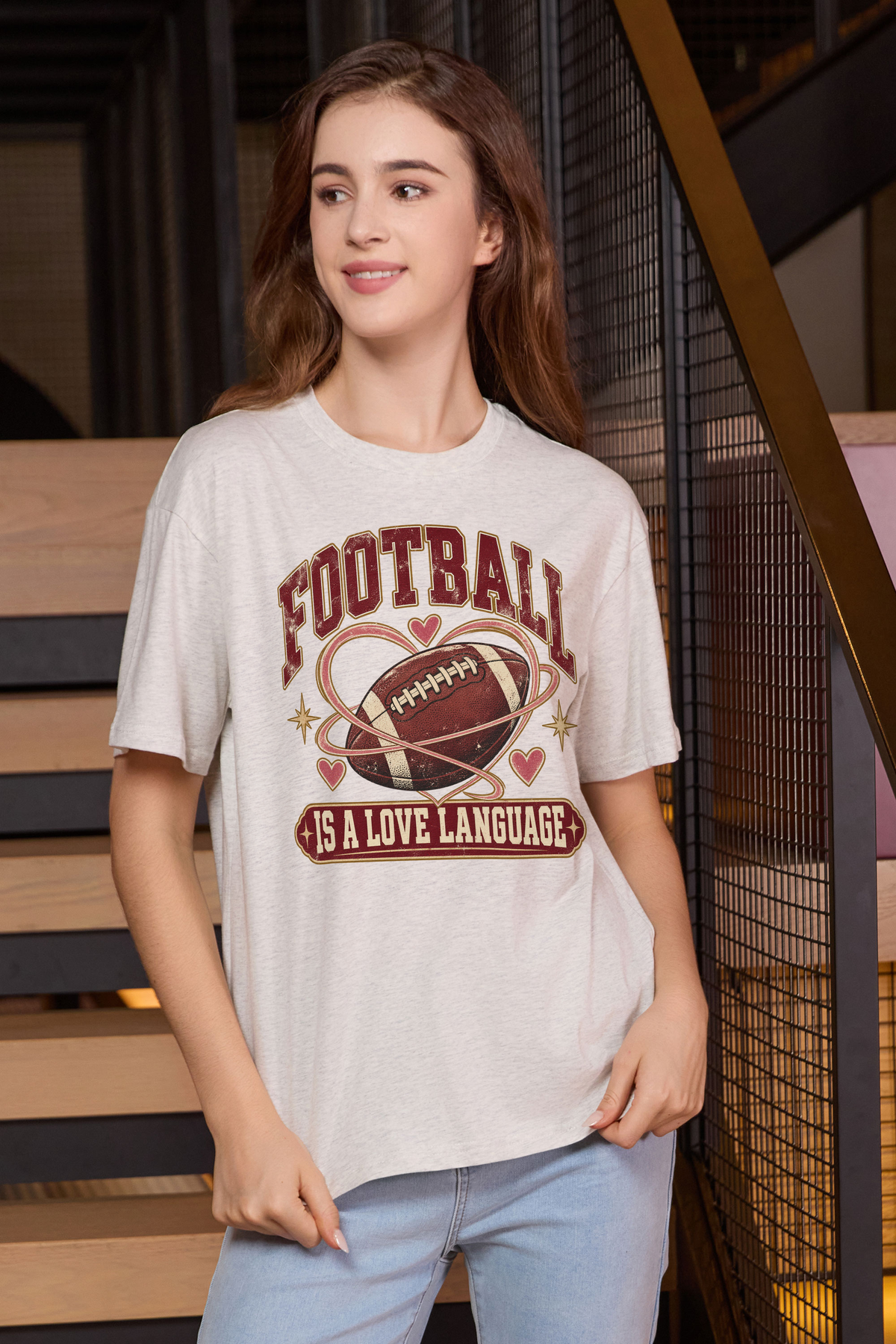 Football Is a Love Language Relaxed Tee in heather grey, front graphic on model, view 1