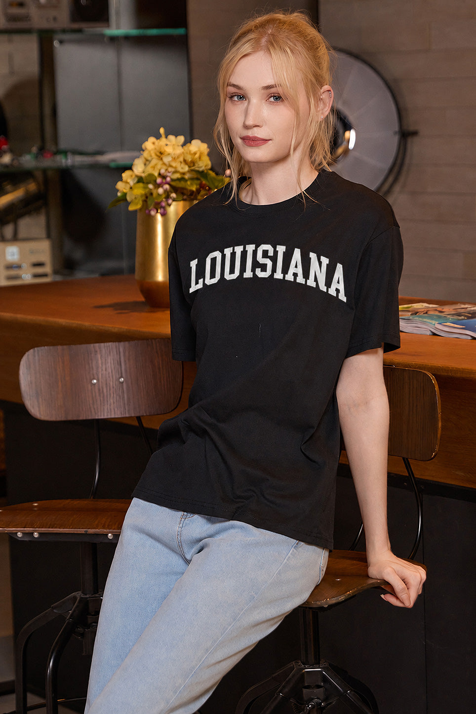 Louisiana Collegiate Tee — black with white lettering — seated front view 4