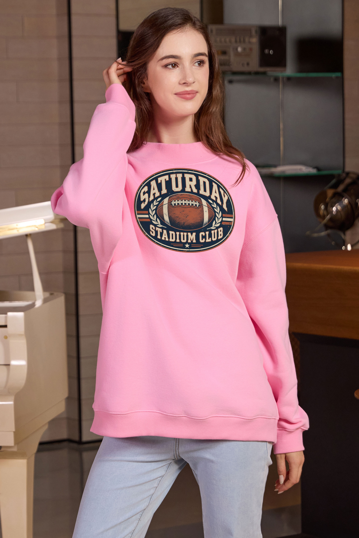 Saturday Stadium Club Mockneck Sweatshirt in light pink, front graphic on model, view 1