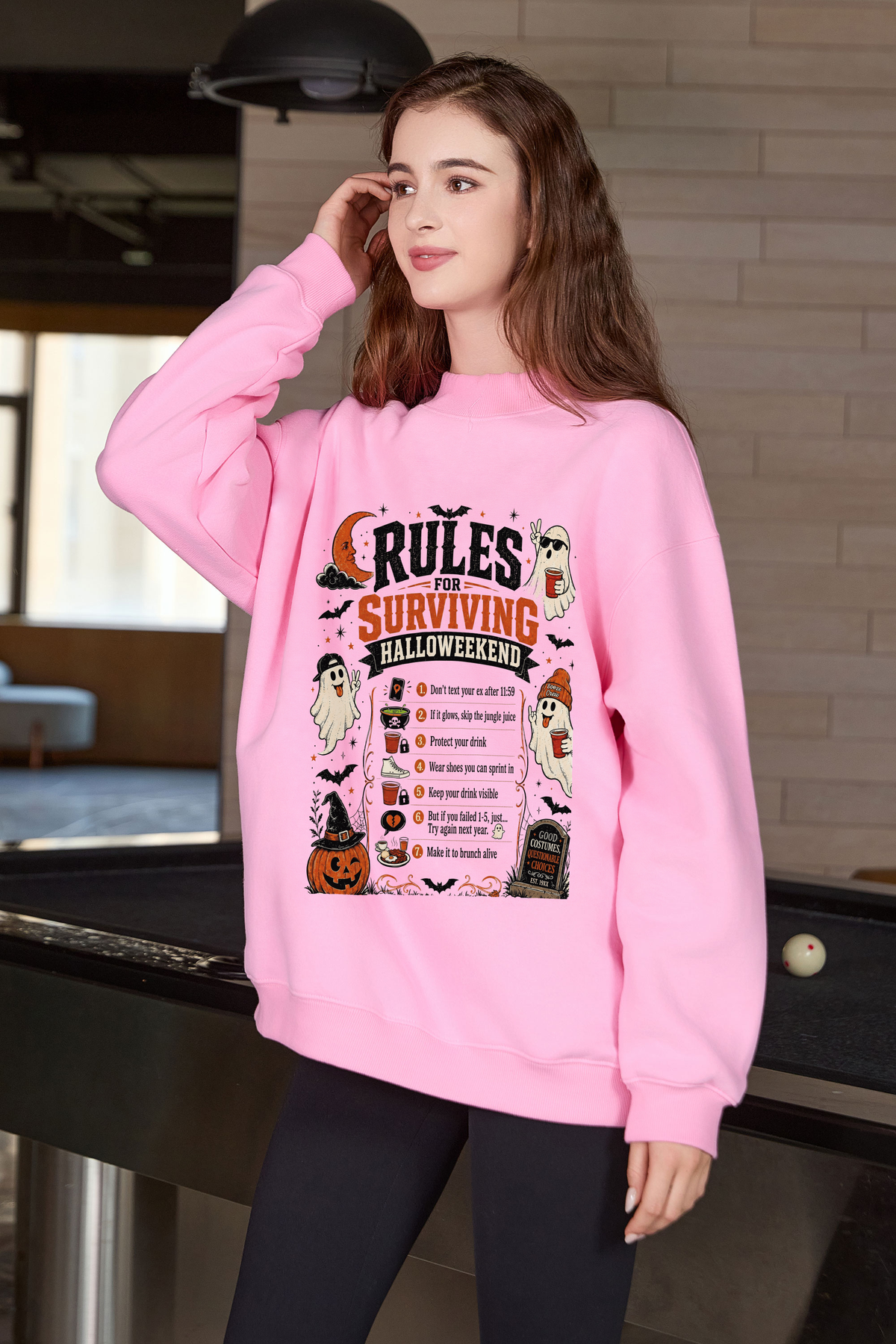 Moshita Rules for Surviving Halloweekend mockneck sweatshirt in light pink — graphic front view 1