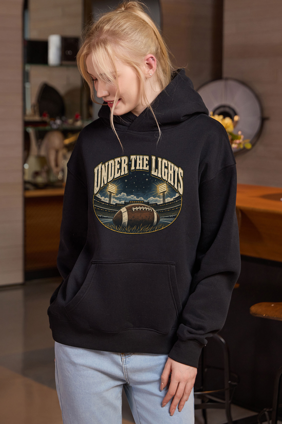 Under the Lights Hoodie in black, front graphic on model, view 1