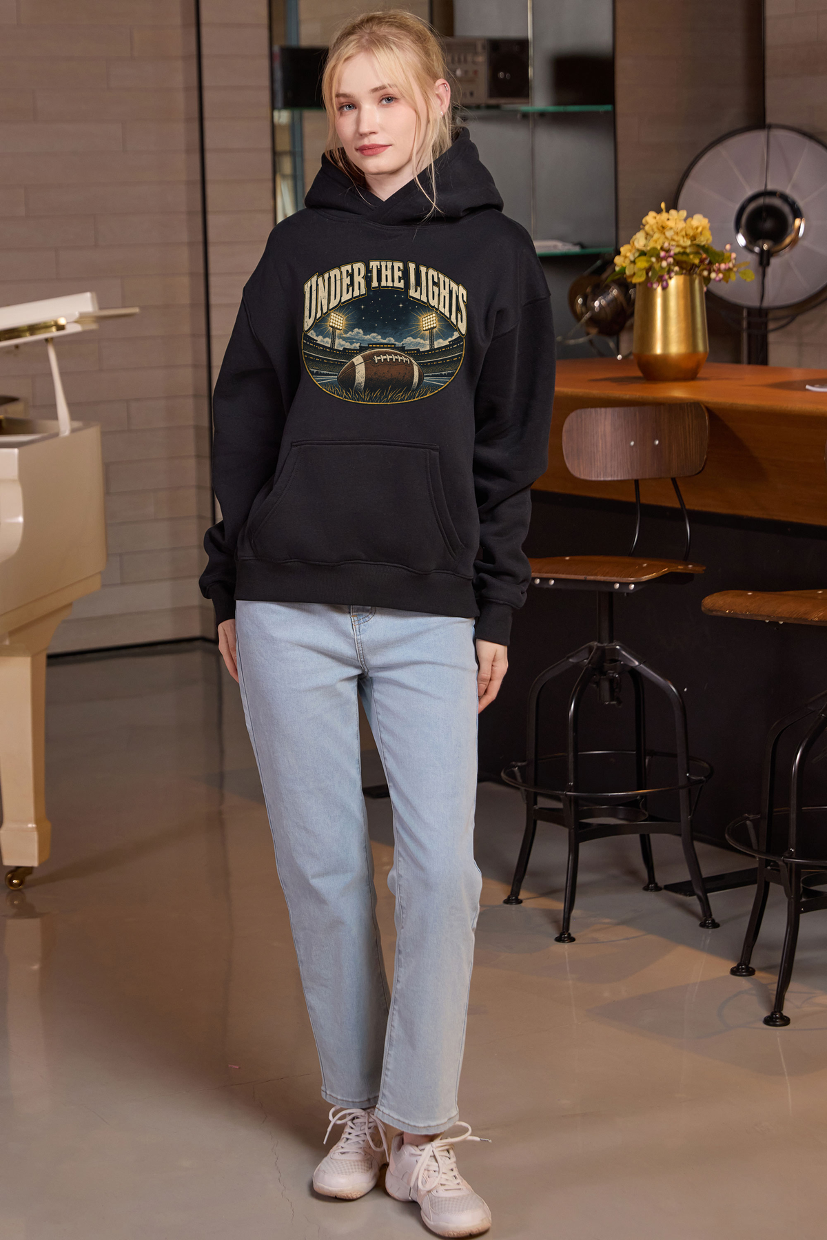 Under the Lights Hoodie in black, front graphic on model, view 3