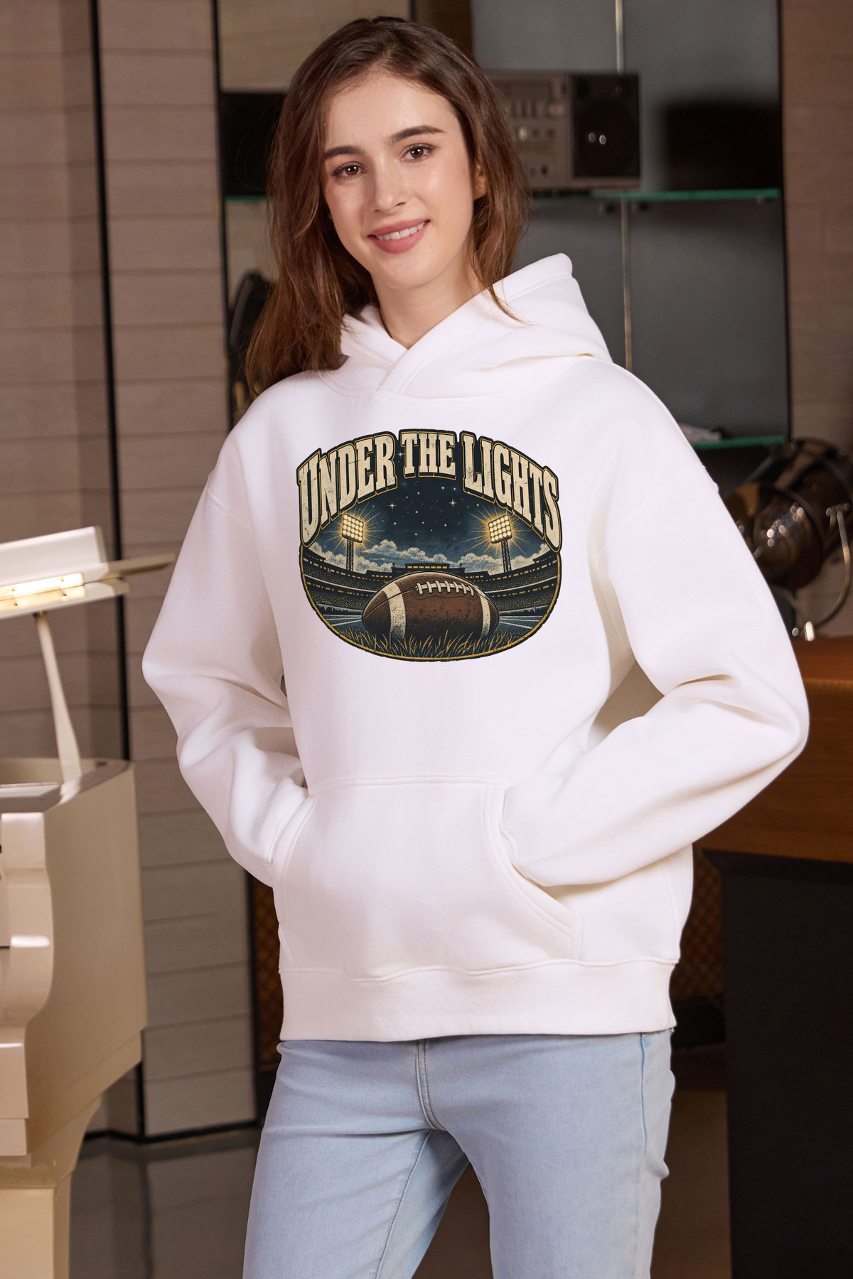 Under the Lights Hoodie in white, front graphic on model, view 1