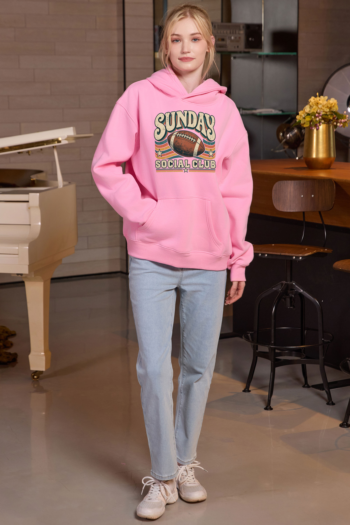 Sunday Social Club Hoodie in light pink, front graphic on model, view 2