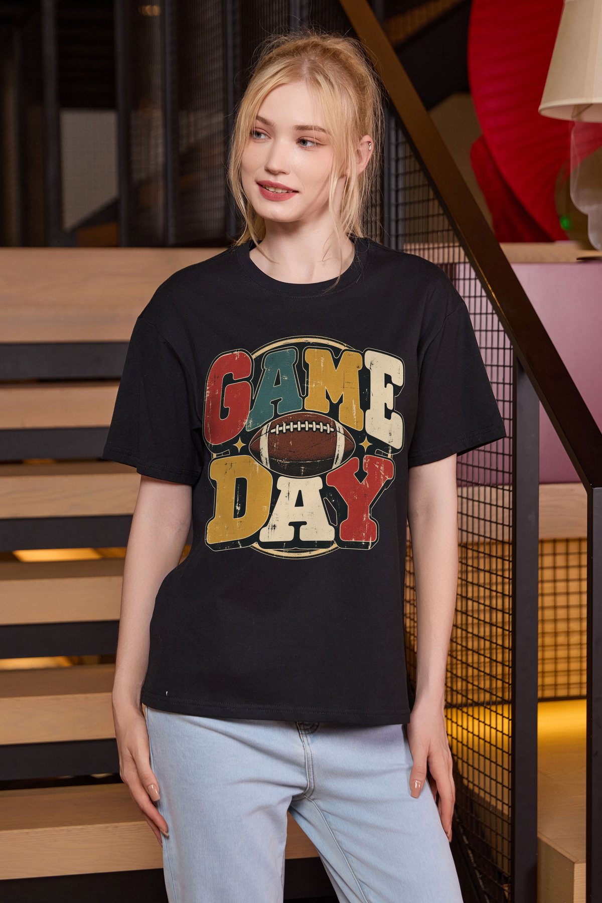 Retro Game Day Relaxed Tee in black with multicolour GAME DAY lettering and a football graphic.