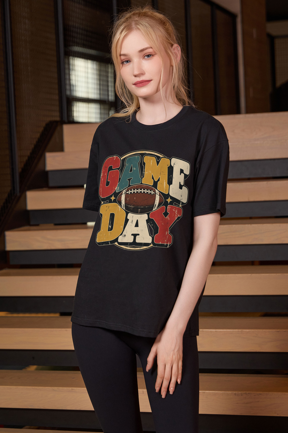 Retro Game Day Relaxed Tee in black with multicolour GAME DAY lettering and a football graphic.
