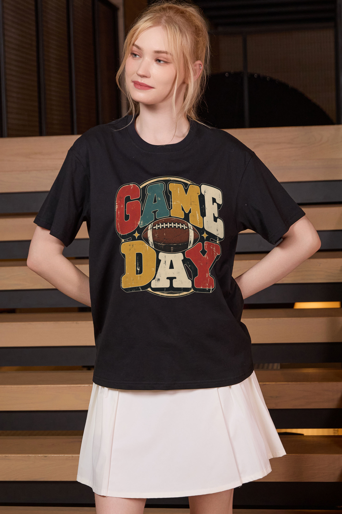 Retro Game Day Relaxed Tee in black with multicolour GAME DAY lettering and a football graphic.